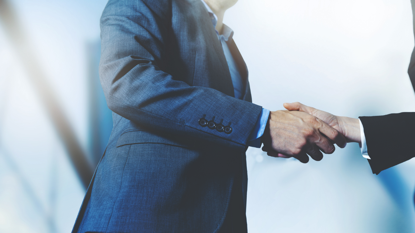 信頼関係を築く握手のイメージ